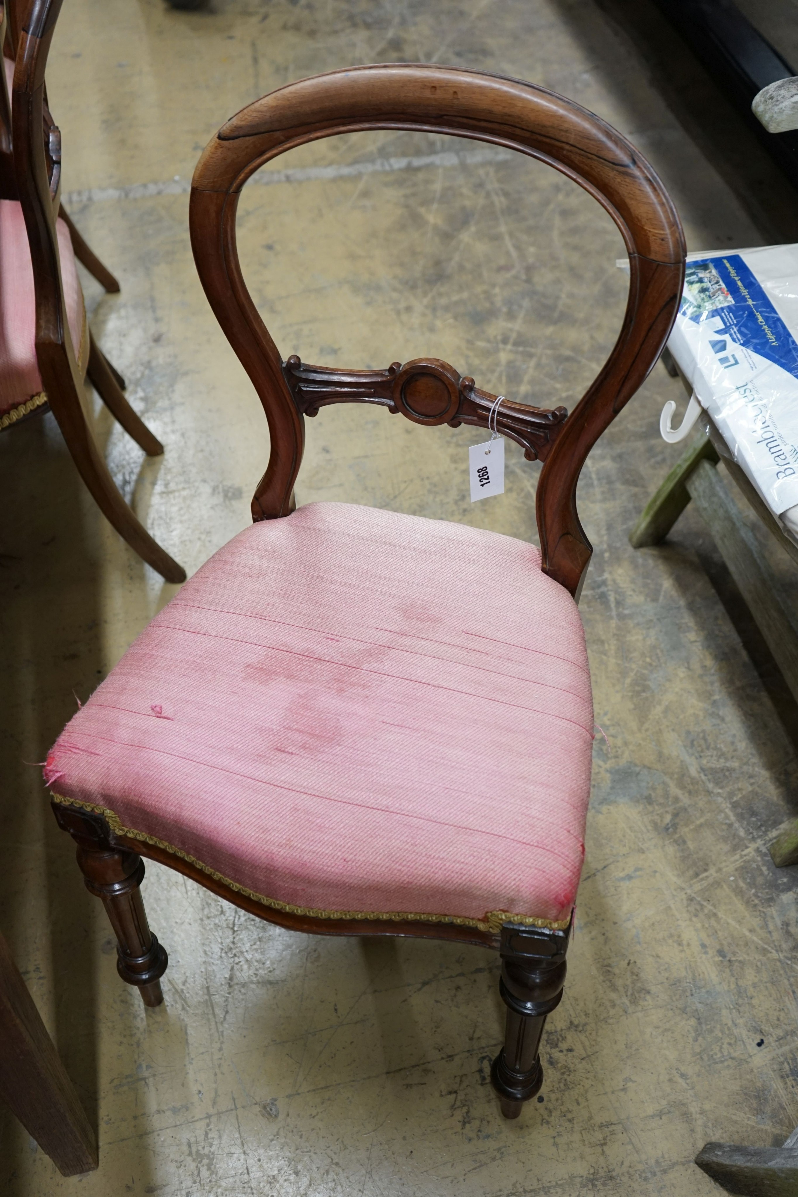 A set of four Victorian rosewood balloon back dining chairs